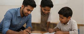 Photo — mentor helping a boy with homework