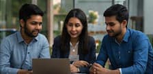 Photo — volunteers looking at a laptop together
